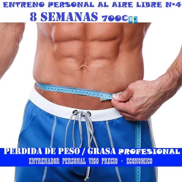 cuerpo definido de hombre con cinta métrica en mano derecha midiendo la cintura